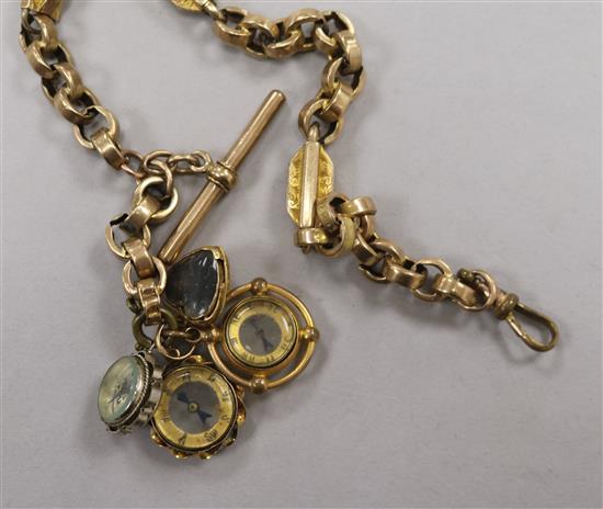 A 9ct gold fancy link albert hung with four assorted charms including three compasses.